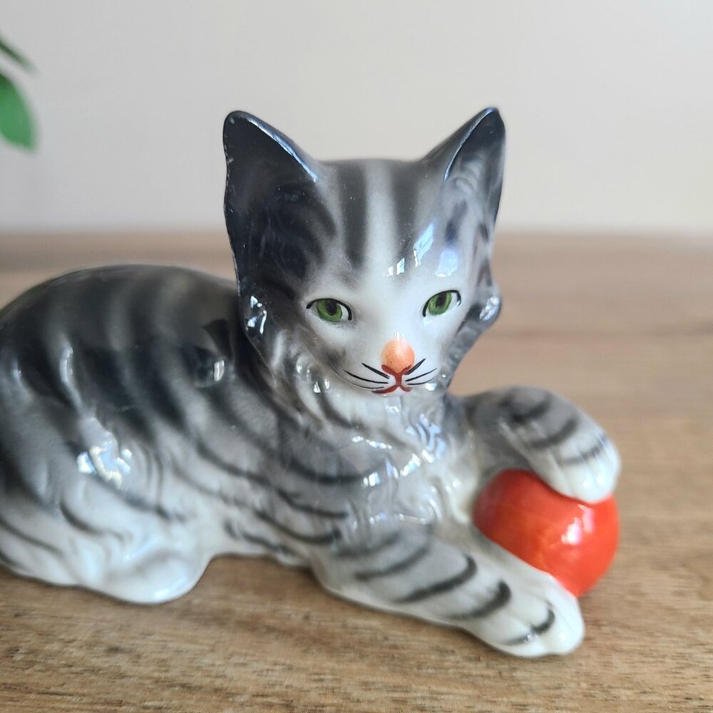 Vintage Germany(?) porcelain/ceramic kitten/cat playing with red bowl figurine.